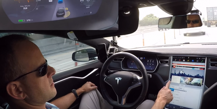 Inside a self driving car at 75mph whilst the driver is browsing the web and doing paperwork