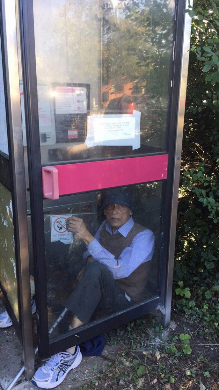 LIVE   Man refuses to leave phone box as BT try to remove it