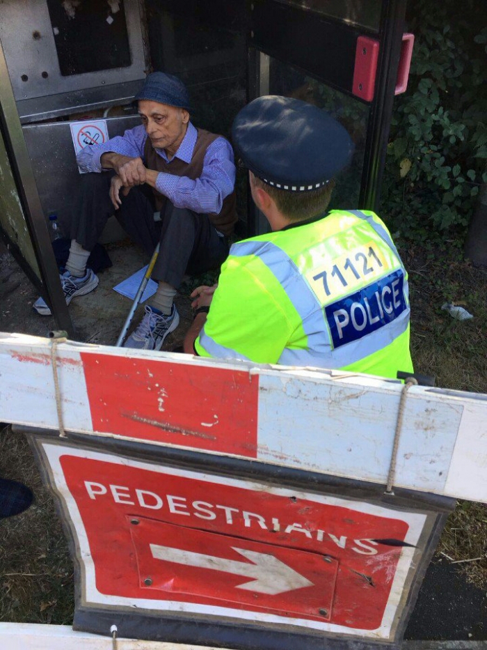 LIVE   Man refuses to leave phone box as BT try to remove it