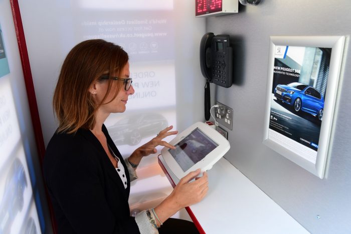 Peugeot announce new car dealership... in a phone box