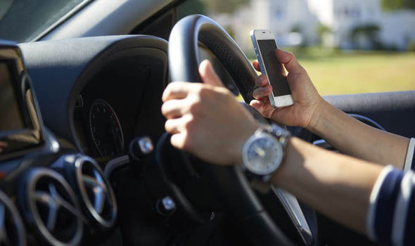 A fifth of UK drivers admit to using their mobiles behind the wheel